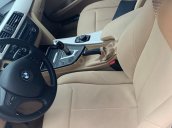 Cần bán xe BMW 320i 2014 ĐK 2015, số tự động màu trắng