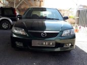 Bán Mazda 323 năm sản xuất 2002, màu đen, xe nhập 