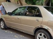 Bán xe Ford Laser Deluxe 1.6 MT đời 2002, màu vàng cát, 260 triệu