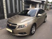 Gia đình cần bán Cruze 2010, số sàn, màu vàng cát