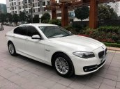 Chính chủ bán BMW 520i màu trắng kem SX 2015, cửa hít, màn NBT, loa Harman