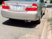 Cần bán lại xe Toyota Camry sản xuất 2003, màu vàng cát