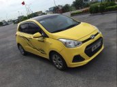 Bán ô tô Hyundai Grand i10 2015, màu vàng, xe đẹp, gầm bệ chắc chắn đã nên đồ chơi