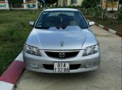 Cần bán lại xe Mazda 323 đời 2003, màu bạc