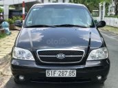 Cần bán xe Kia Carnival 2.5AT đời 2009, màu đen