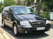 Cần bán xe Kia Carnival 2.5AT đời 2009, màu đen