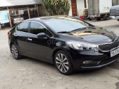 Nhu cầu đổi xe 7 chỗ nên bán Kia K3 1.6AT 2014