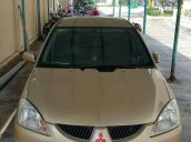 Cần bán lại xe Mitsubishi Lancer đời 2004, màu vàng xe gia đình, giá chỉ 230 triệu