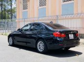 Cần bán xe BMW 320i đời 2014, màu đen nhập khẩu