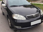 Cần bán Corolla Altis 2005 số sàn, màu đen, xe zin cọp