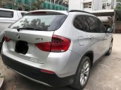 Cần bán em Bmw X1 số tự động 2010, màu xám bạc