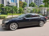 Cần bán xe Mazda 6 năm sản xuất 2014, màu đen, giá 660tr xe còn mới lắm