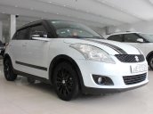 Cần bán Suzuki Swift 1.4AT sx 2016, số tự động, màu trắng, xe đẹp, giá còn TL