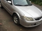 Cần bán gấp Mazda 323 năm 2004, màu bạc còn mới