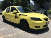Bán ô tô Mazda 3 đời 2004, màu vàng còn mới