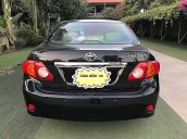 Bán Toyota Corolla Altis đời 2010, màu đen xe còn mới lắm