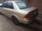 Bán Ford Laser 2002, màu vàng, xe nhập