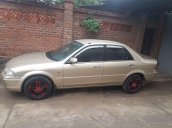 Bán Ford Laser 2002, màu vàng, xe nhập