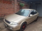 Bán Ford Laser 2002, màu vàng, xe nhập