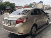 Cần bán Toyota Vios sản xuất 2016, màu vàng xe gia đình