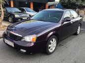 Cần bán gấp Daewoo Magnus đời 2003, màu tím số sàn