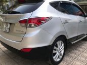 Cần bán Hyundai Tucson 2.0 AT 4WD đời 2011, màu bạc, nhập khẩu