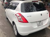 Cần bán gấp Suzuki Swift sản xuất 2014, màu trắng, giá tốt