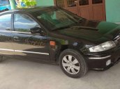 Cần bán xe cũ Mazda 323 2000, màu đen, xe nhập 