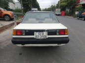 Cần tiền bán Toyota Corolla 1985, màu trắng, nhập khẩu, máy nguyên bản