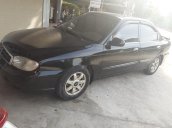 Bán xe Kia Spectra đời 2004, màu đen xe gia đình