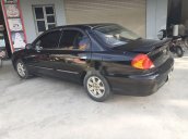 Bán xe Kia Spectra đời 2004, màu đen xe gia đình