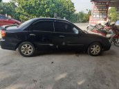 Bán xe Kia Spectra đời 2004, màu đen xe gia đình