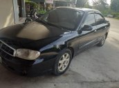 Bán xe Kia Spectra đời 2004, màu đen xe gia đình