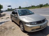 Gia đình bán xe cũ Mitsubishi Lancer năm 2004, màu vàng cát