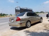 Gia đình bán xe cũ Mitsubishi Lancer năm 2004, màu vàng cát