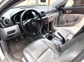 Chính chủ cần tiền bán xe Mazda 3 đời 2006, màu bạc số sàn