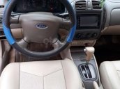 Cần bán xe Ford Laser GHIA 1.8 AT 2004, màu đen  