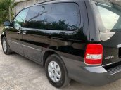 Cần bán gấp Kia Carnival năm sản xuất 2006, màu đen còn mới