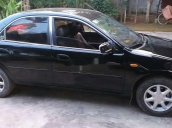 Cần bán gấp Mazda 323 đời 2000, màu đen xe gia đình