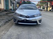 Cần bán lại xe Toyota Corolla Altis đời 2015, màu bạc còn mới 