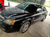 Cần bán gấp Daewoo Magnus sản xuất 2004, màu đen  