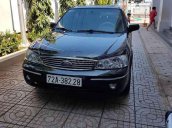 Cần bán xe Ford Laser Ghia 1.8 AT sản xuất 2004, màu đen, nhập khẩu giá cạnh tranh