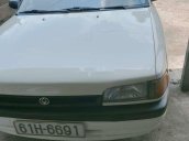 Cần bán gấp Mazda 323 đời 1995, màu trắng