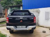 Bán Mitsubishi Triton 4x2 AT năm 2015, màu đen, nhập khẩu còn mới 
