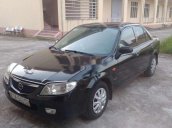 Cần bán Mazda 323 năm 2002, màu đen