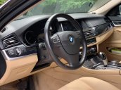 BMW 520i sản xuất 2014 đen/kem biển HN, full option: Cửa hit, đá cốp, màn hình to