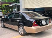 Cần bán gấp Daewoo Magnus 2004, màu đen  