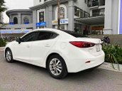 Cần bán Mazda 3 AT sản xuất 2015, màu trắng còn mới 