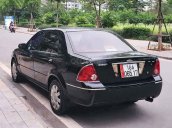 Cần bán xe Ford Laser Ghia 1.8 MT sản xuất năm 2003, màu đen, giá cạnh tranh