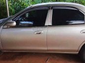 Cần bán lại xe Mazda 323 đời 2000, màu ghi vàng